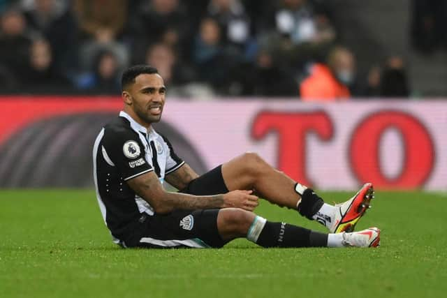 Callum Wilson of Newcastle United reacts with an injury during the Premier League match between Newcastle United  and  Manchester United at St James' Park on December 27, 2021 in Newcastle upon Tyne, England. (Photo by Stu Forster/Getty Images)