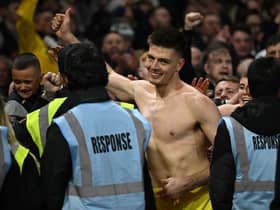Newcastle United goalkeeper Nick Pope celebrates with fans at the City Ground.