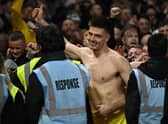 Newcastle United goalkeeper Nick Pope celebrates with fans at the City Ground.