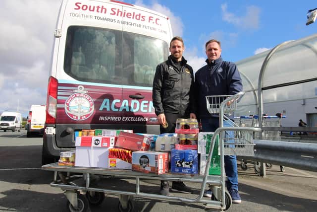 South Shields Football Club captain Jon Shaw, left, and business development manager Colin Docherty get ready to deliver the items to the food bank.