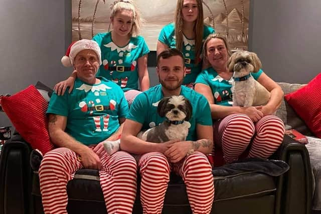 Tyler Robertson (centre front) with dad Lee (left front), mum Nicola (right front) and sisters Skye and Libby.