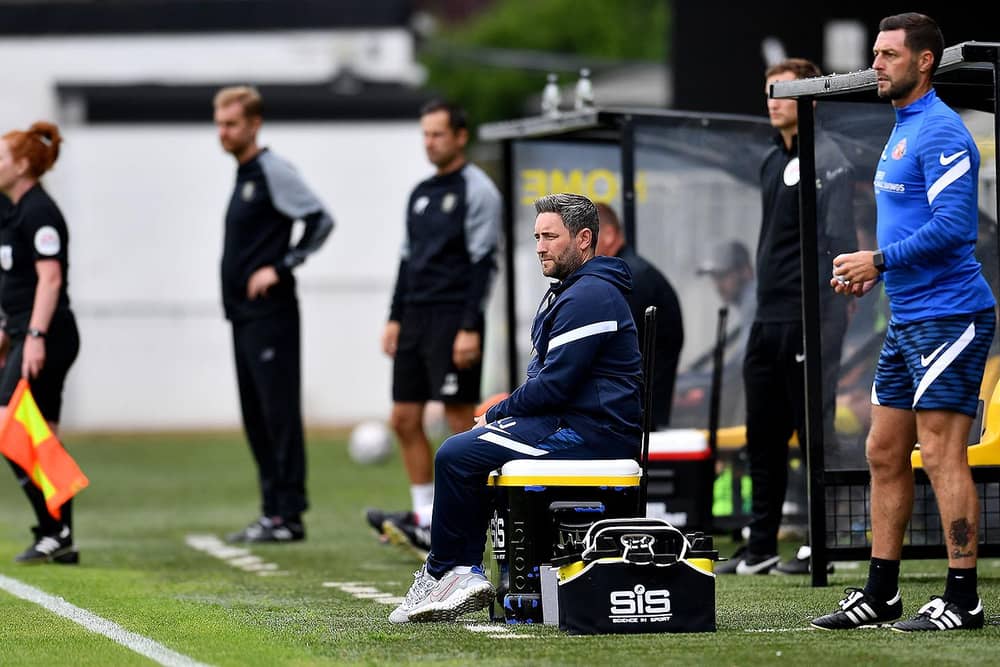 Sunderland boss Lee Johnson watches on at Harrogate