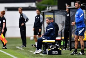 Sunderland boss Lee Johnson watches on at Harrogate