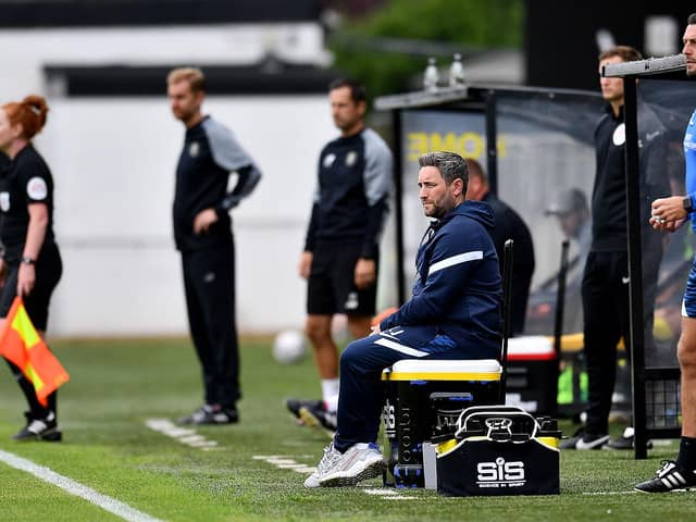 Sunderland boss Lee Johnson watches on at Harrogate
