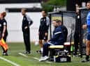 Sunderland boss Lee Johnson watches on at Harrogate