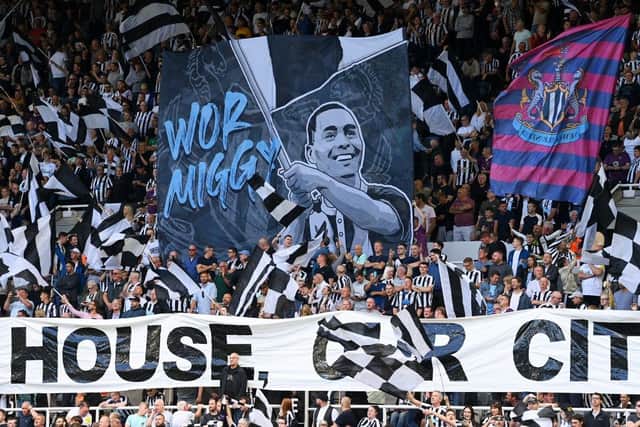 Newcastle United fans display a flag at St James's Park.