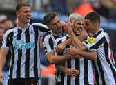 Newcastle player Bruno Guimaraes (2nd r) celebrates his second goal with Sven Botman (l) Fabian Schar and Miguel Almiron (r) during the Premier League match between Newcastle United and Brentford FC at St. James Park on October 08, 2022 in Newcastle upon Tyne, England. (Photo by Stu Forster/Getty Images)