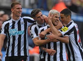 Newcastle player Bruno Guimaraes (2nd r) celebrates his second goal with Sven Botman (l) Fabian Schar and Miguel Almiron (r) during the Premier League match between Newcastle United and Brentford FC at St. James Park on October 08, 2022 in Newcastle upon Tyne, England. (Photo by Stu Forster/Getty Images)