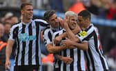 Newcastle player Bruno Guimaraes (2nd r) celebrates his second goal with Sven Botman (l) Fabian Schar and Miguel Almiron (r) during the Premier League match between Newcastle United and Brentford FC at St. James Park on October 08, 2022 in Newcastle upon Tyne, England. (Photo by Stu Forster/Getty Images)