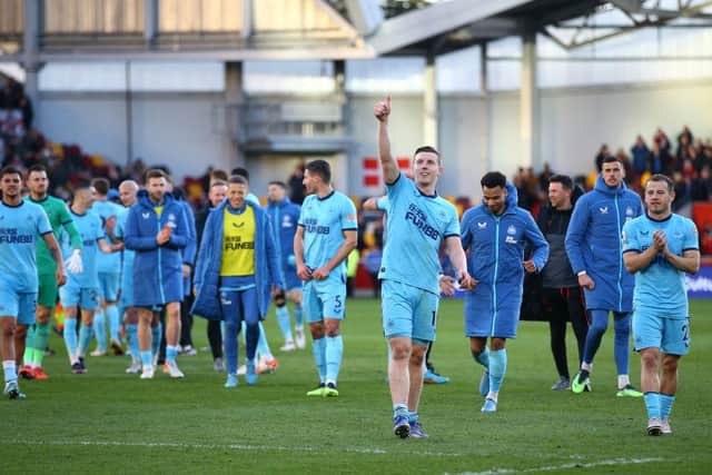 Matt Targett of Newcastle United acknowledges the fans after their sides victory during the Premier League match between Brentford and Newcastle United at Brentford Community Stadium on February 26, 2022 in Brentford, England. (Photo by Luke Walker/Getty Images)