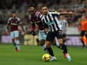 Callum Wilson of Newcastle United battles for possession with Angelo Ogbonna of West Ham United during the Premier League match between Newcastle United and West Ham United at St. James Park on February 04, 2023 in Newcastle upon Tyne, England. (Photo by Ian MacNicol/Getty Images)
