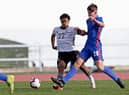 Yannick Numbisie (L) of Germany U16's  challenges Tyler Dibling (R) of England U16's during the UEFA Development Tournament U16 match between U16 England vs U16 Germany at Estadio Municipal de Vila Real de Santo Antonio on February 12, 2022 in Vila Real de Santo Antonio, Portugal. (Photo by Ricardo Nascimento/Getty Images for DFB)