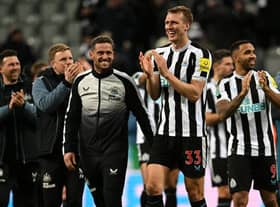 Newcastle United's Dan Burn applauds fans after the club's Carabao Cup win over Leicester City.