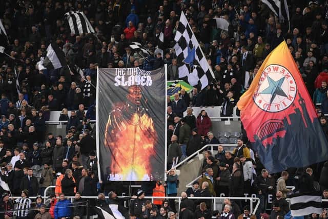 A flag in the Gallowgate end shows Shola Ameobi "The Mackem Slayer" during the Premier League match between Newcastle United and Leeds United at St. James Park on December 31, 2022 in Newcastle upon Tyne, England. (Photo by Stu Forster/Getty Images)