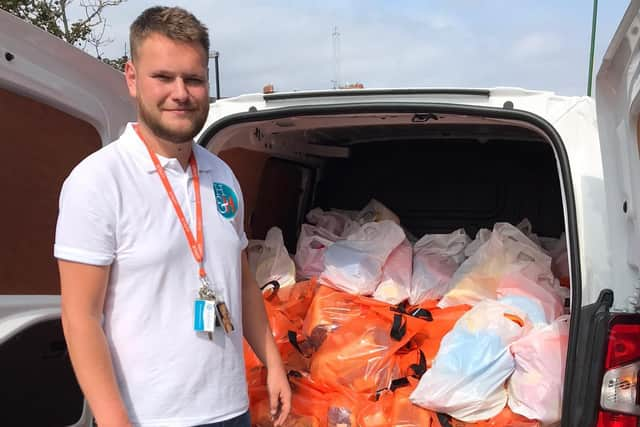 Connor Sullivan, the food bank officer at Hospitality and Hope, getting ready for his daily delivery.