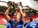 Lewis Cass of Hartlepool United celebrates with the trophy following the Vanarama National League Play-Off Final match between Hartlepool United and Torquay United at Ashton Gate on June 20, 2021 in Bristol, England. (Photo by Harry Trump/Getty Images)