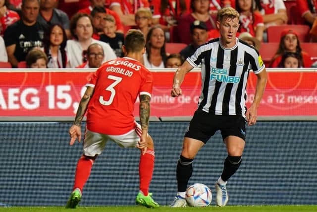 Emil Krafth of Newcastle United FC with Alex Grimaldo of SL Benfica in action during the Eusebio Cup match between SL Benfica and Newcastle United at Estadio da Luz on July 26, 2022 in Lisbon, Portugal. (Photo by Gualter Fatia/Getty Images)