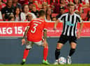 Emil Krafth of Newcastle United FC with Alex Grimaldo of SL Benfica in action during the Eusebio Cup match between SL Benfica and Newcastle United at Estadio da Luz on July 26, 2022 in Lisbon, Portugal.  (Photo by Gualter Fatia/Getty Images)