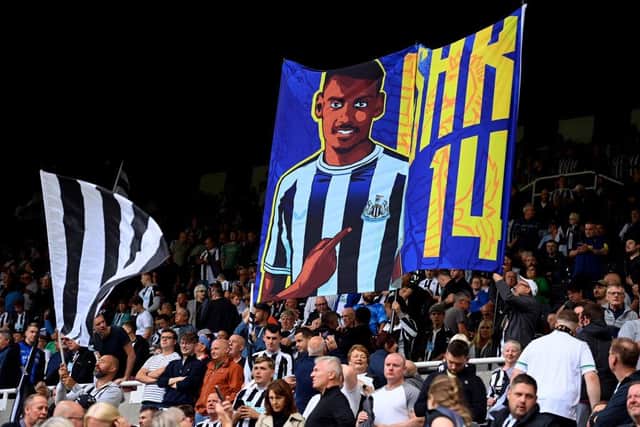 Newcastle United fans unveil a flag containing the face of Alexander Isak of Newcastle United (not pictured) prior to the Premier League match between Newcastle United and Crystal Palace at St. James Park on September 03, 2022 in Newcastle upon Tyne, England. (Photo by Stu Forster/Getty Images)