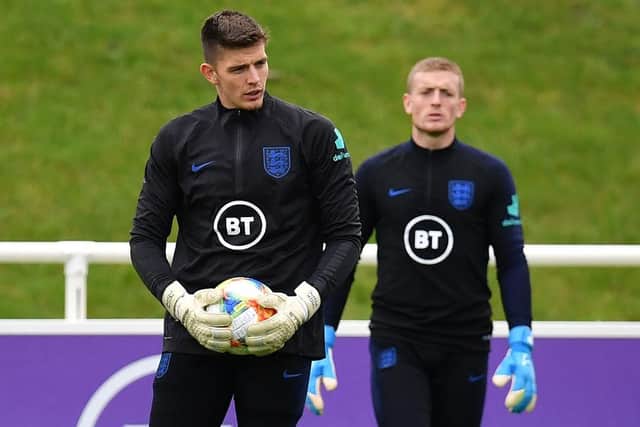 England's goalkeeper Nick Pope (L) and England's goalkeeper Jordan Pickford attend an England team training session at St George's Park in Burton-on-Trent (Photo by PAUL ELLIS/AFP via Getty Images)