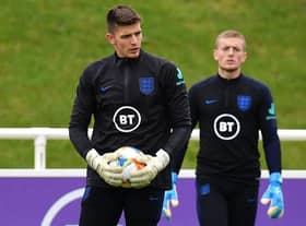 England's goalkeeper Nick Pope (L) and England's goalkeeper Jordan Pickford attend an England team training session at St George's Park in Burton-on-Trent  (Photo by PAUL ELLIS/AFP via Getty Images)