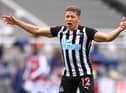 Dwight Gayle  of Newcastle reacts during the Premier League match between Newcastle United and Arsenal at St. James Park on May 02, 2021 in Newcastle upon Tyne, England.