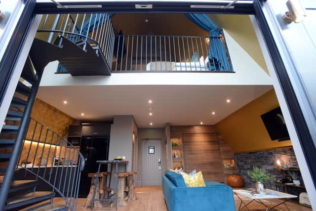 The main bedroom is accessed via a spiral staircase