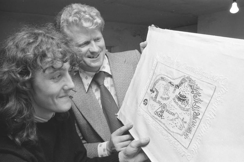 Proprietor of Lowes art gallery, Mr William Lowe (right) and picture framer and restorer, Mr Kevin Delaney, examine the embroidered map which was be presented to the Queen. Who remembers this from 1977?