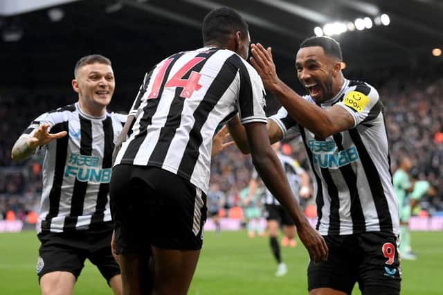 Alexander Isak of Newcastle United celebrates with teammates after scoring the team's first goal during the Premier League match between Newcastle United and Fulham FC at St. James Park on January 15, 2023 in Newcastle upon Tyne, England. (Photo by Stu Forster/Getty Images)