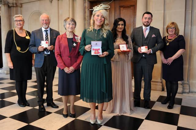 Lord Lieutenant of Tyne and Wear Mrs Susan Winfield presents an OBE and BEM medals at South Shields Town Hall, with the Mayor Cllr Pat Hay.
