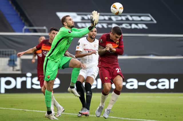 AS Roma's Spanish goalkeeper Pau Lopez clears the ball during the UEFA Europa League round of 16 football match between Sevilla FC and AS Roma at the MSV Arena on August 6, 2020 in Duisburg. (Photo by Friedemann Vogel / various sources / AFP) (Photo by FRIEDEMANN VOGEL/AFP via Getty Images)