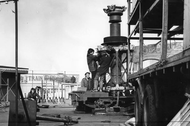 Showmen assembling the Cyclone Twist fairground ride in South Shields in 1970.