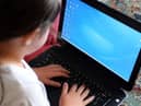 Row flares over schools laptop provision.