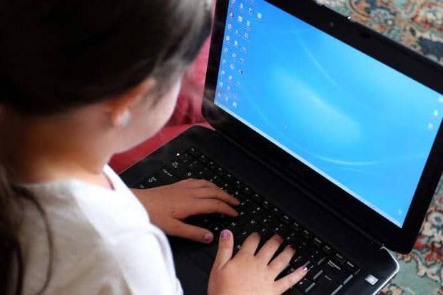 Row flares over schools laptop provision.