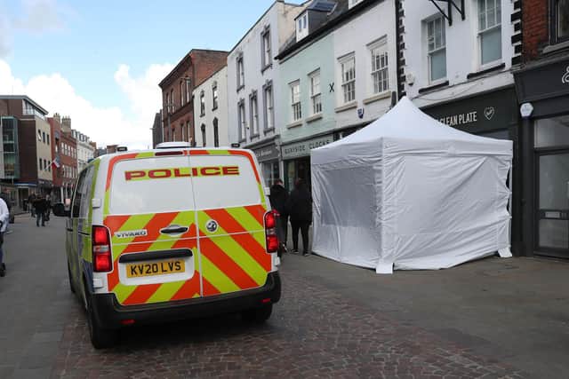 A police tent outside The Clean Plate cafe in Southgate Street, Gloucester. Picture date: Tuesday May 11, 2021.