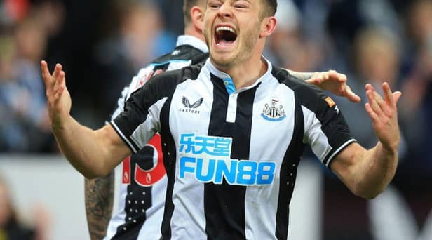 Ryan Fraser celebrates scoring his first Newcastle United goal of the season (Photo by LINDSEY PARNABY/AFP via Getty Images)