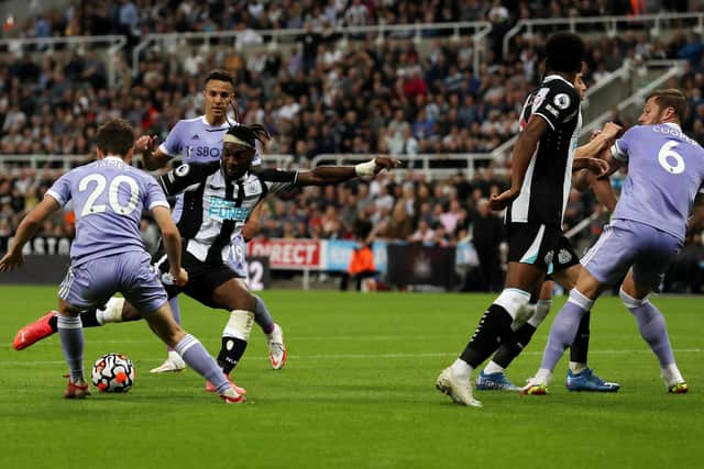 NEWCASTLE UPON TYNE, ENGLAND - SEPTEMBER 17: Allan Saint-Maximin of Newcastle United  scores their team's first goal  during the Premier League match between Newcastle United and Leeds United at St. James Park on September 17, 2021 in Newcastle upon Tyne, England. (Photo by Ian MacNicol/Getty Images)