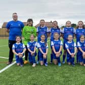Jarrow U11 Hurricanes FC Manager Steven Scott and players are photographed in their new strip alongside Amy Cooper daughter of kit sponsor Jo Seales. Picture by Frank Reid