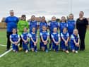 Jarrow U11 Hurricanes FC Manager Steven Scott and players are photographed in their new strip alongside Amy Cooper daughter of kit sponsor Jo Seales. Picture by Frank Reid