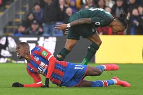 Newcastle United's Austrian midfielder Valentino Lazaro (L) fouls Crystal Palace's Ivorian striker Wilfried Zaha during the English Premier League football match between Crystal Palace and Newcastle United at Selhurst Park in south London on February 22, 2020.