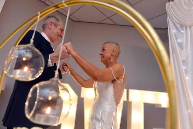 Judith Elliott Laing enjoys a dance on her wedding day with husband Paul Laing.