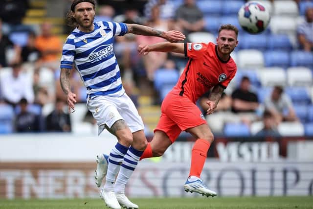 Alexis Mac Allister of Brighton and Hove Albion is challenged by Jeff Hendrick of Reading at the Select Car Leasing Stadium on July 23, 2022 in Reading, England. (Photo by Eddie Keogh/Getty Images)