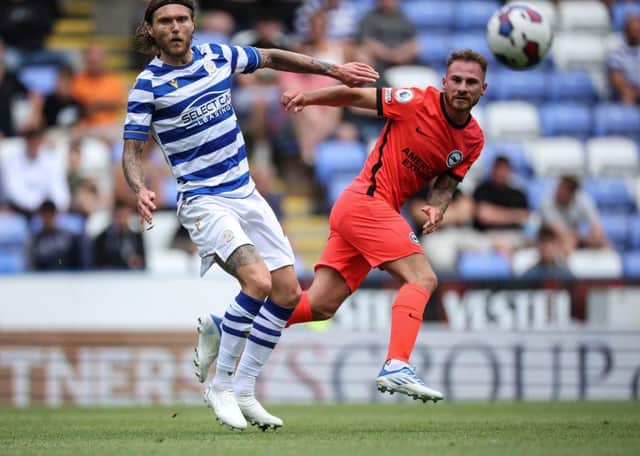 Alexis Mac Allister of Brighton and Hove Albion is challenged by Jeff Hendrick of Reading at the Select Car Leasing Stadium on July 23, 2022 in Reading, England. (Photo by Eddie Keogh/Getty Images)