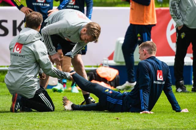 Sweden's defender Emil Krafth is treated during a training session on May 26, 2021 in Bastad, Sweden, where the Swedish national football team started its preparation for the upcoming EURO 2020 football tournament.