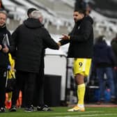 Fulham's Aleksandar Mitrovic speaks with Newcastle United head coach Steve Bruce.
