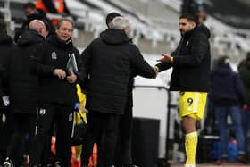 Fulham's Aleksandar Mitrovic speaks with Newcastle United head coach Steve Bruce.