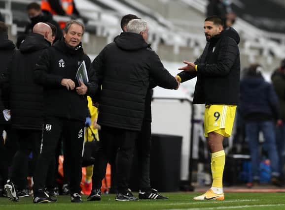 Fulham's Aleksandar Mitrovic speaks with Newcastle United head coach Steve Bruce.