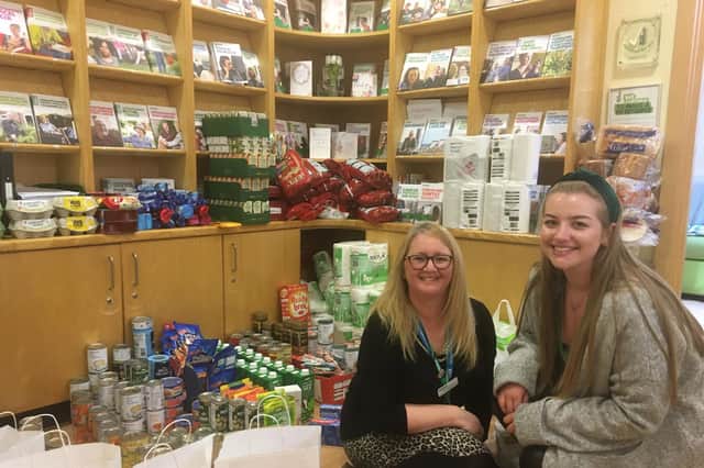 Louise McMahon and Jessica Rainbow with items collected for patients during the pandemic.