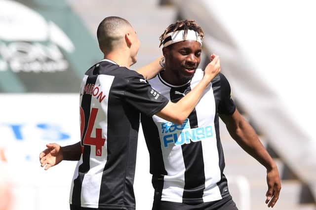 Miguel Almiron, left, celebrates with Allan Saint-Maximin.