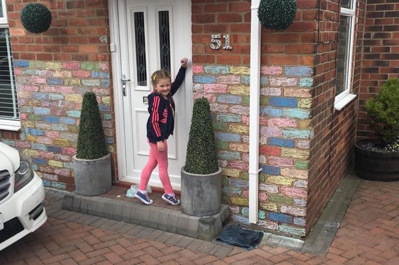 Vicki Ali shared this photo of her niece Faith outside her decorated home.